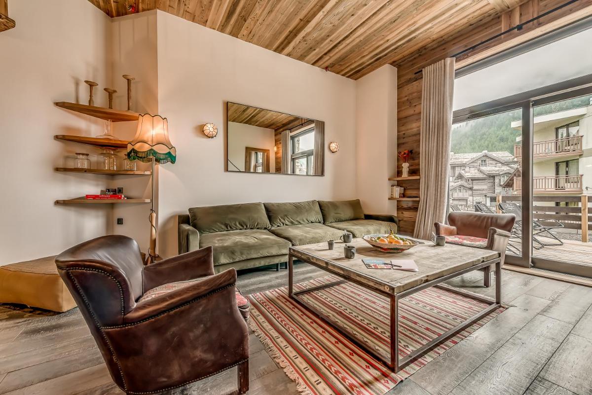 Coin salon dans l'établissement Hotel & Spa Le Val d'Isère
