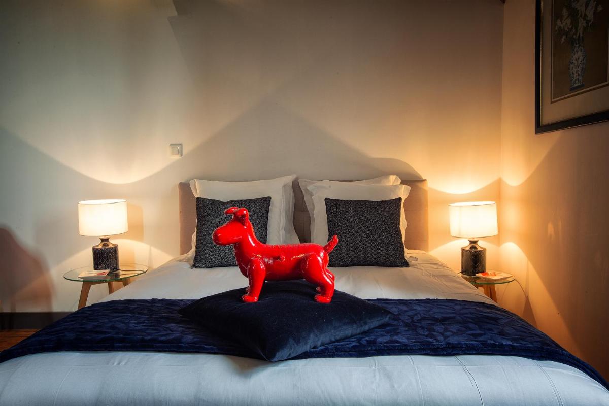 Un ou plusieurs lits dans un hébergement de l'établissement Hôtel & Spa Chai De La Paleine