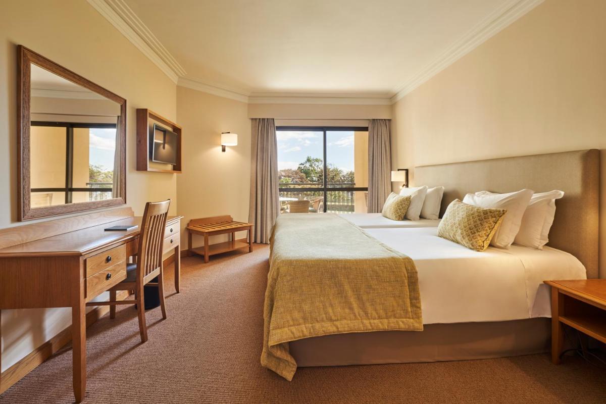 Uma cama ou camas num quarto em The Residence Porto Mare - PortoBay