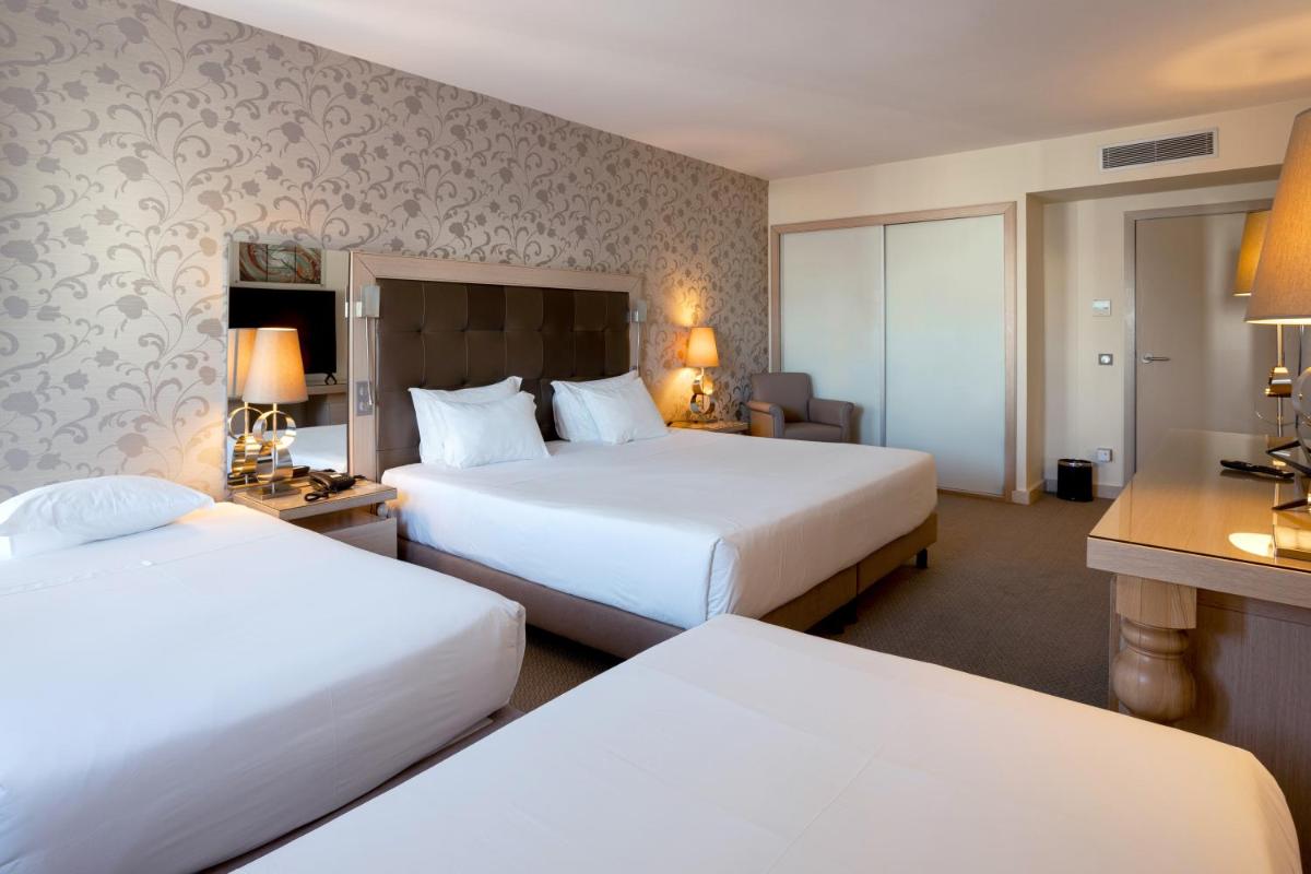 Uma cama ou camas num quarto em Hotel Porta do Sol Conference & SPA