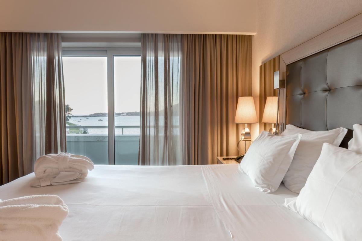 Uma cama ou camas num quarto em Hotel Porta do Sol Conference & SPA