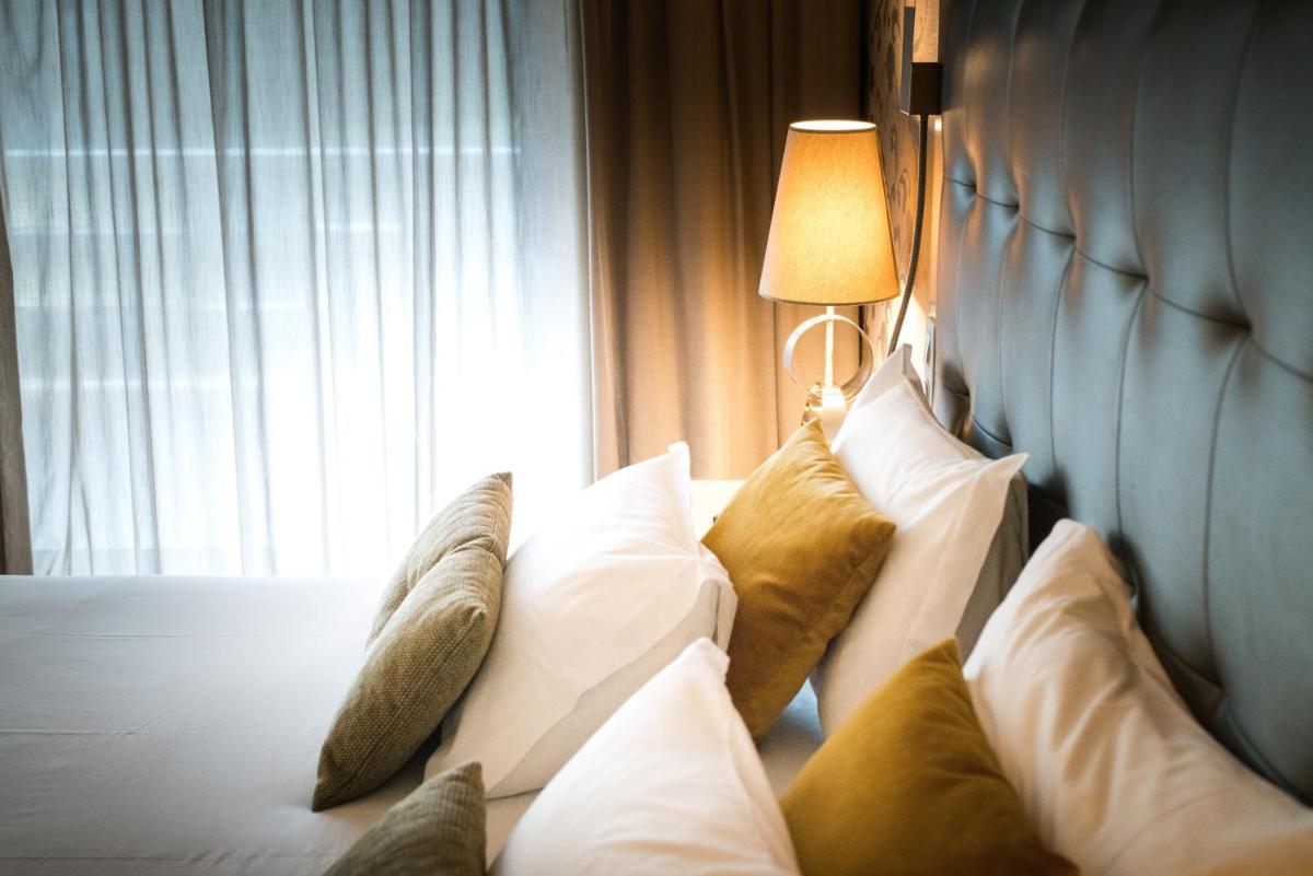 Uma cama ou camas num quarto em Hotel Porta do Sol Conference & SPA