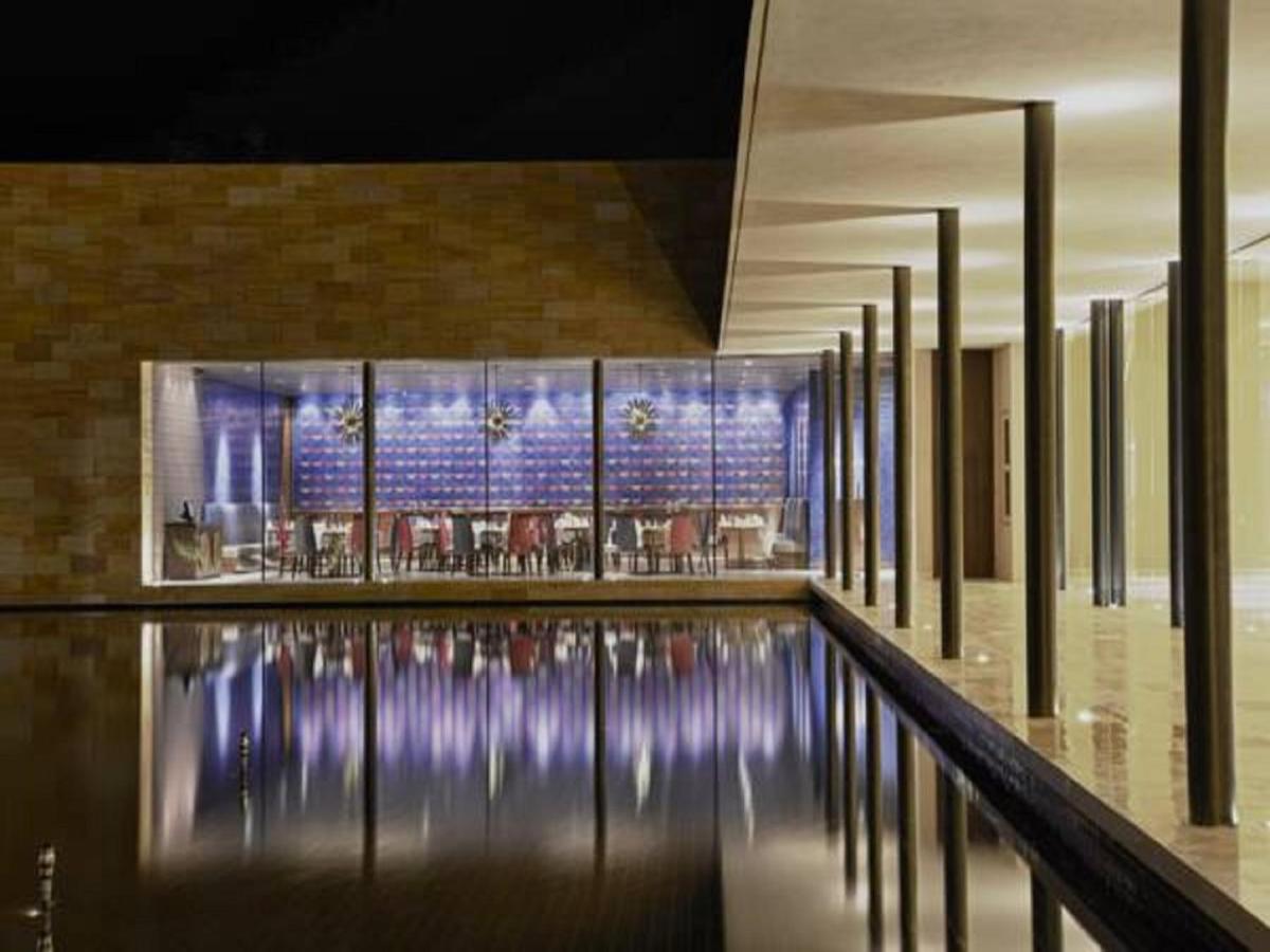 a building with a pool in the middle of it at Marasa Sarovar Premiere in Tirupati
