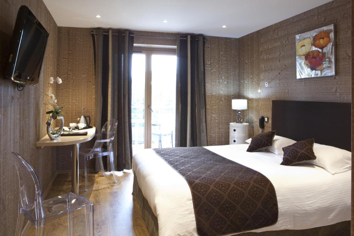 Un ou plusieurs lits dans un hébergement de l'établissement Hotel Blanc