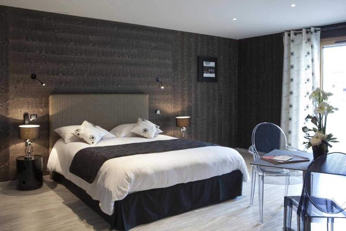Un ou plusieurs lits dans un hébergement de l'établissement Hotel Blanc