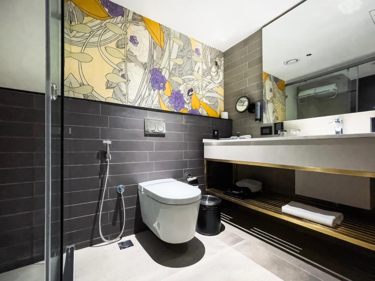 a bathroom with a toilet and a sink at Parallel Hotel Udaipur, a member of Radisson Individuals in Udaipur