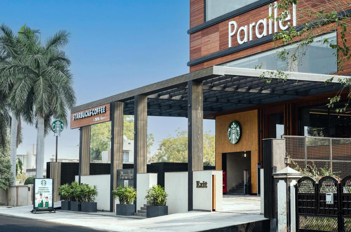 a store front with potted plants in front of it at Parallel Hotel Udaipur, a member of Radisson Individuals in Udaipur