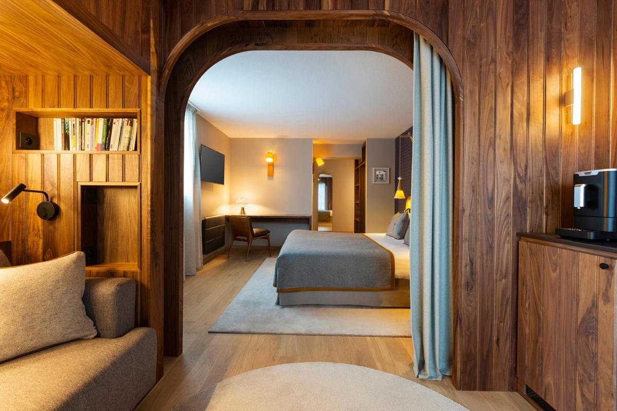 Un ou plusieurs lits dans un hébergement de l'établissement Heliopic Hotel & Spa
