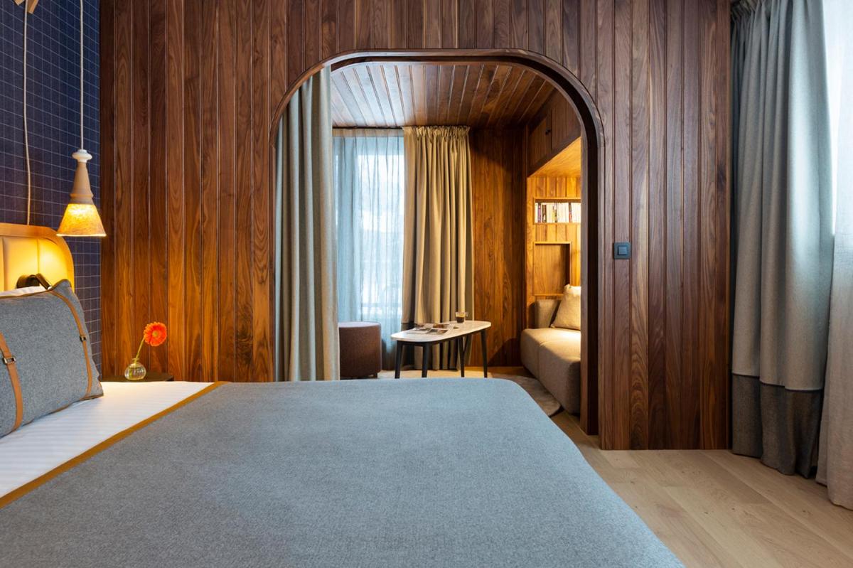 Un ou plusieurs lits dans un hébergement de l'établissement Heliopic Hotel & Spa