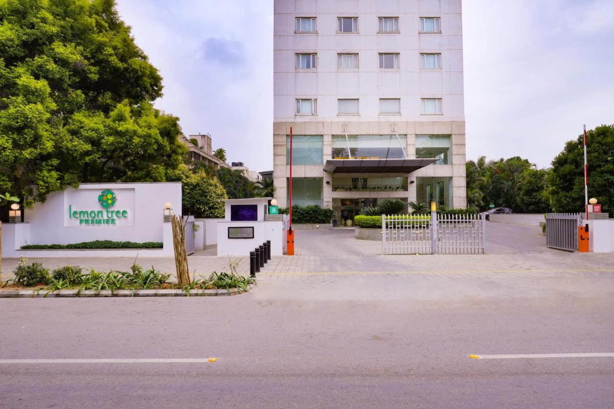 an empty parking lot in front of a building at Lemon Tree Premier, Ulsoor Lake, Bengaluru in Bengaluru