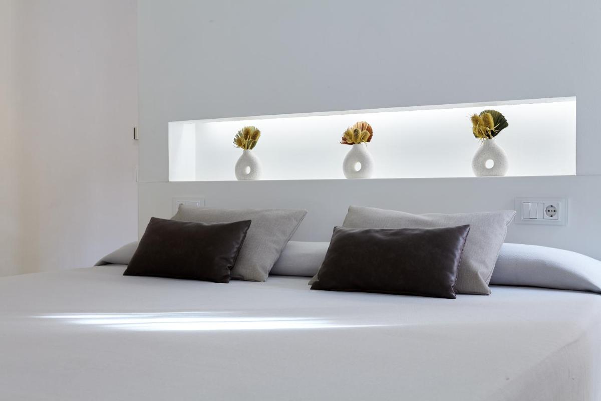 Cama o camas de una habitación en Hotel Maciá Granada Five Senses Rooms & Suites