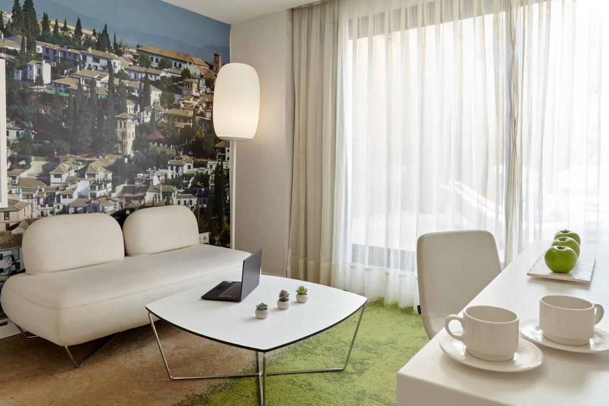 Zona de estar de Hotel Maciá Granada Five Senses Rooms & Suites