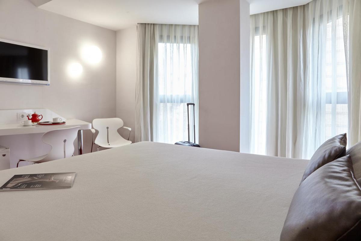 Cama o camas de una habitación en Hotel Maciá Granada Five Senses Rooms & Suites