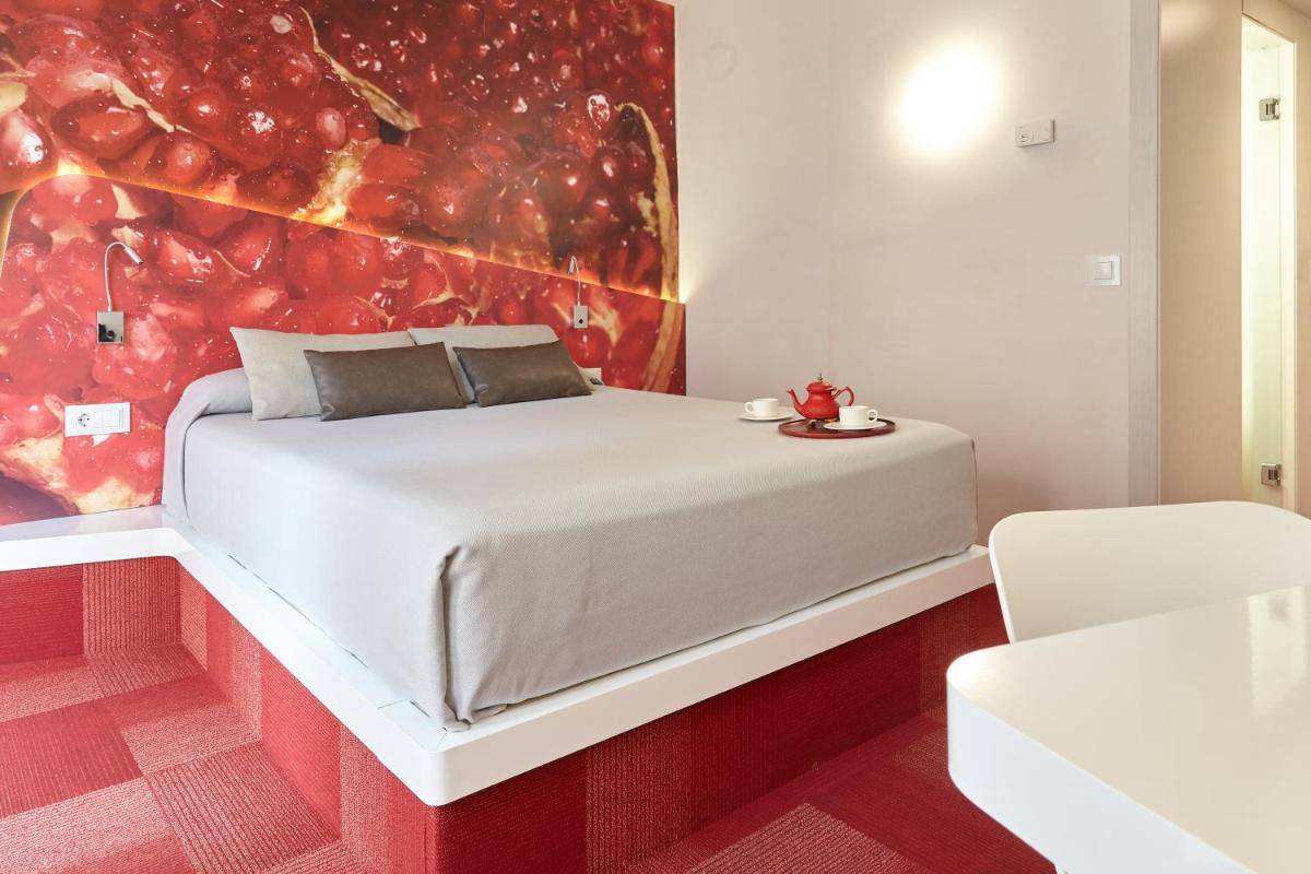Cama o camas de una habitación en Hotel Maciá Granada Five Senses Rooms & Suites