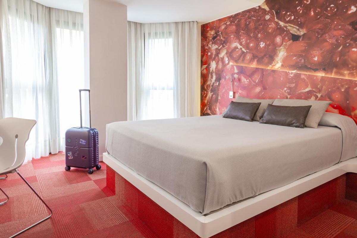 Cama o camas de una habitación en Hotel Maciá Granada Five Senses Rooms & Suites