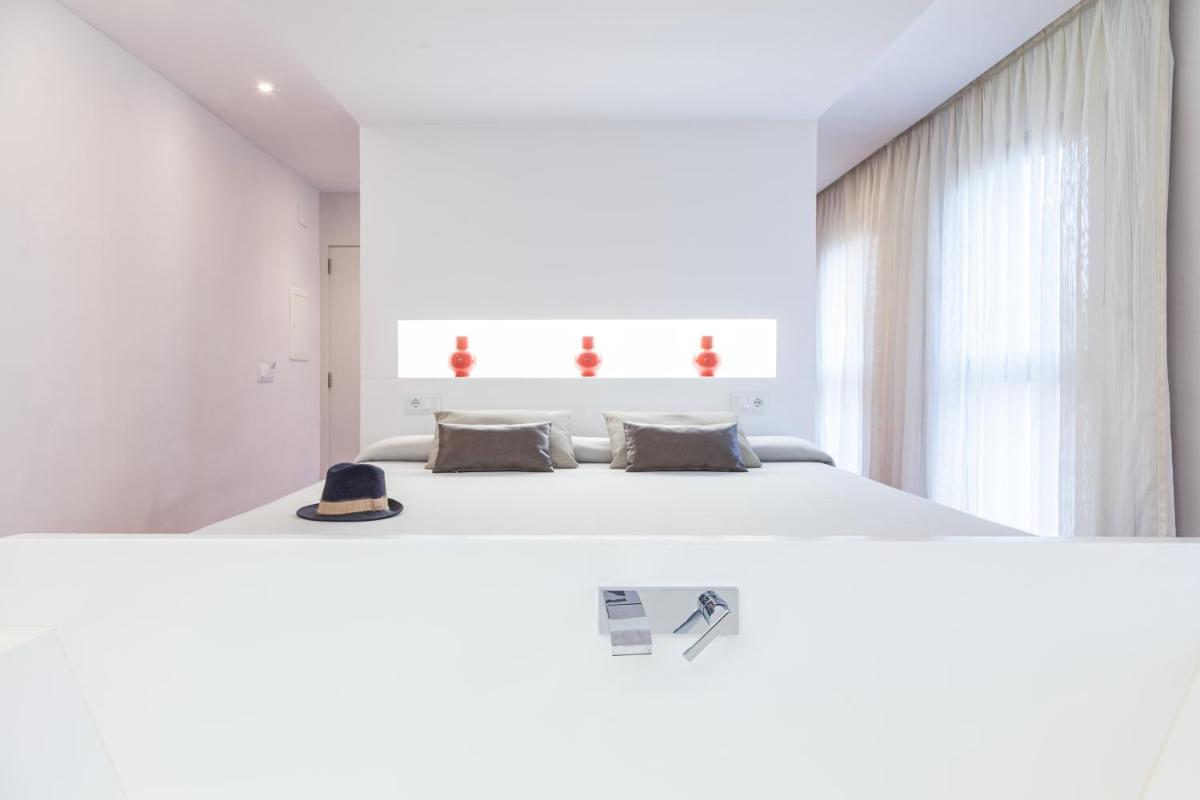Cama o camas de una habitación en Hotel Maciá Granada Five Senses Rooms & Suites
