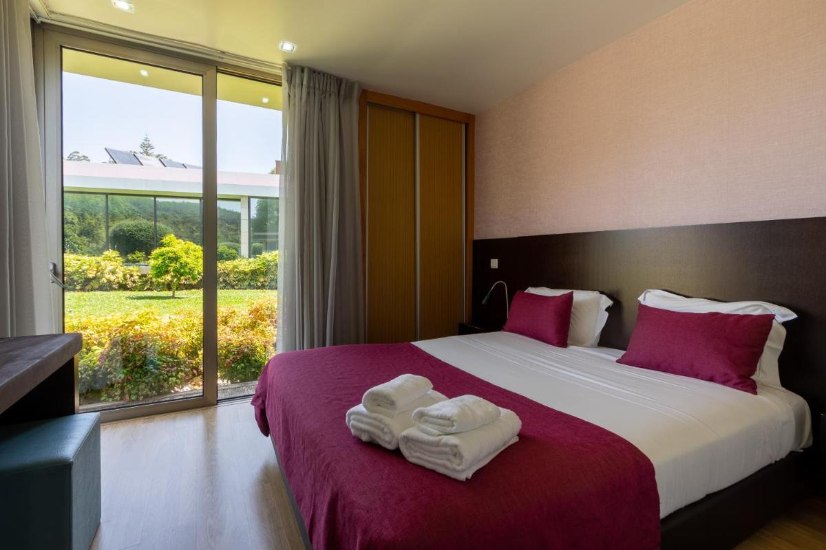Uma cama ou camas num quarto em Prazer da Natureza Resort & Spa