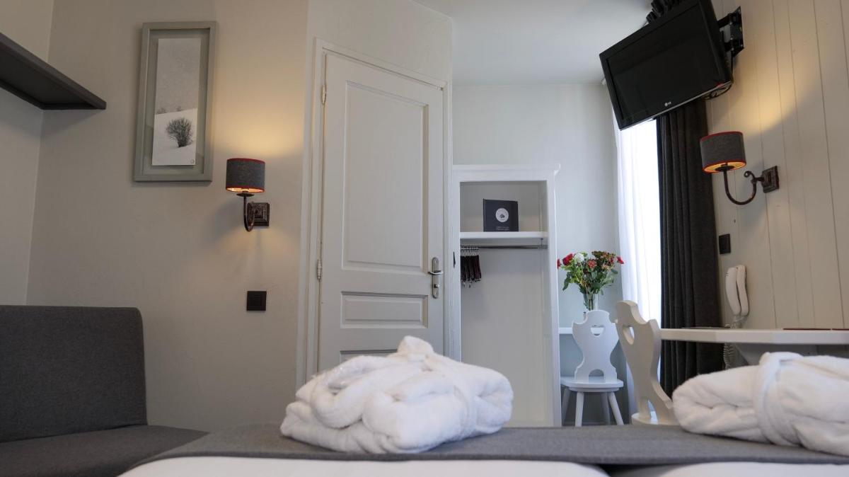 Un ou plusieurs lits dans un hébergement de l'établissement Le Faucigny - Hotel de Charme & SPA