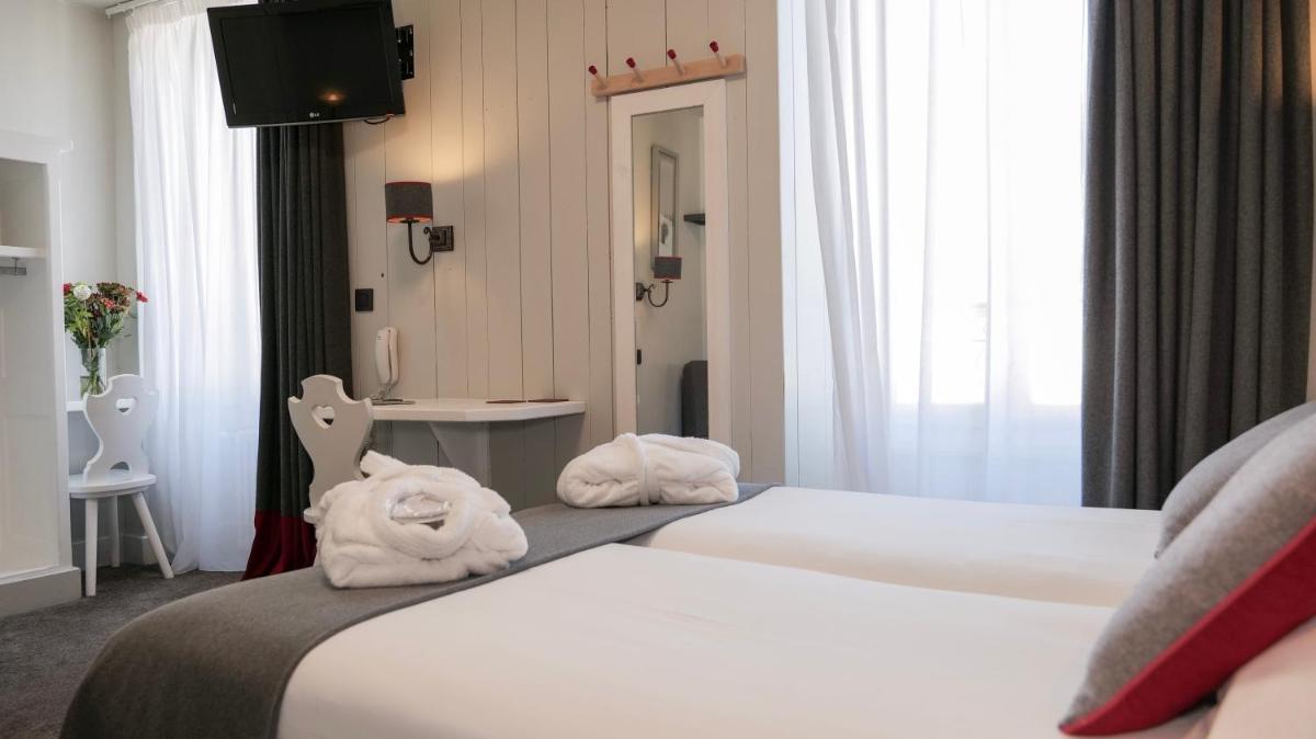 Un ou plusieurs lits dans un hébergement de l'établissement Le Faucigny - Hotel de Charme & SPA