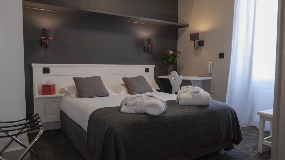 Un ou plusieurs lits dans un hébergement de l'établissement Le Faucigny - Hotel de Charme & SPA