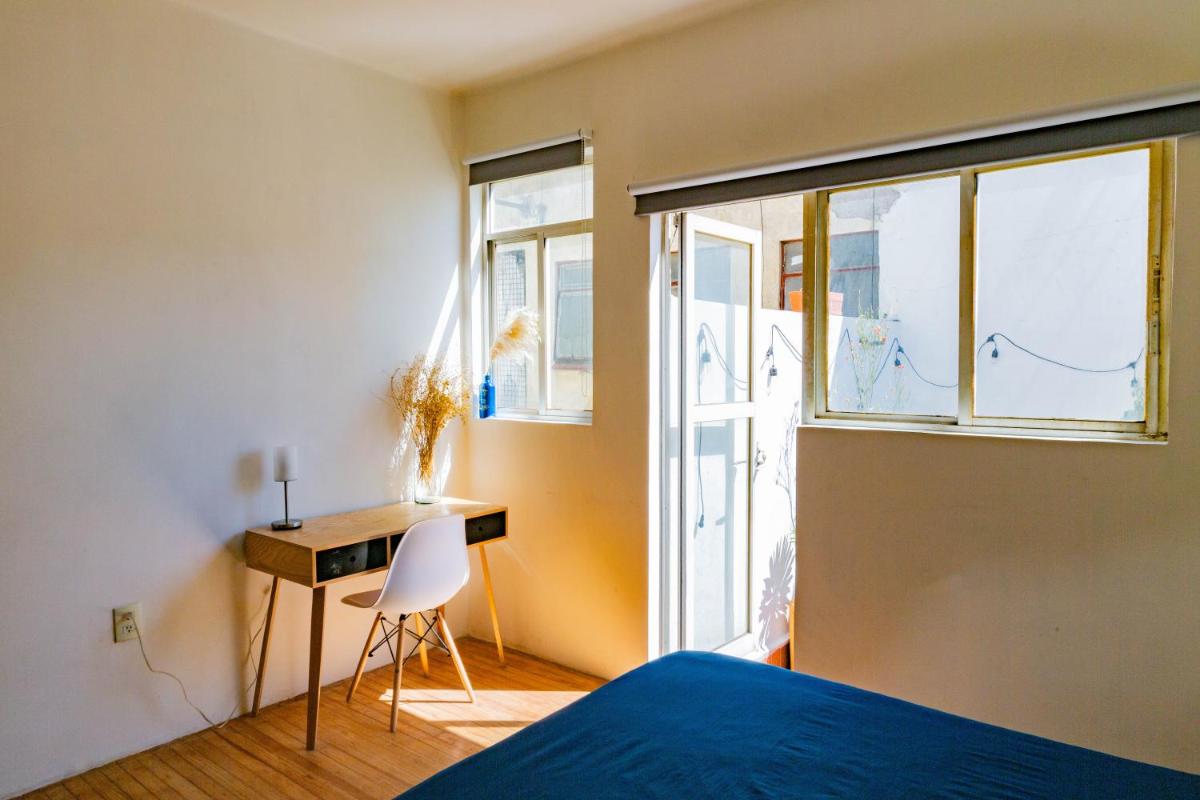 Bedroom with Private Patio in Art Deco Apartment - Housity