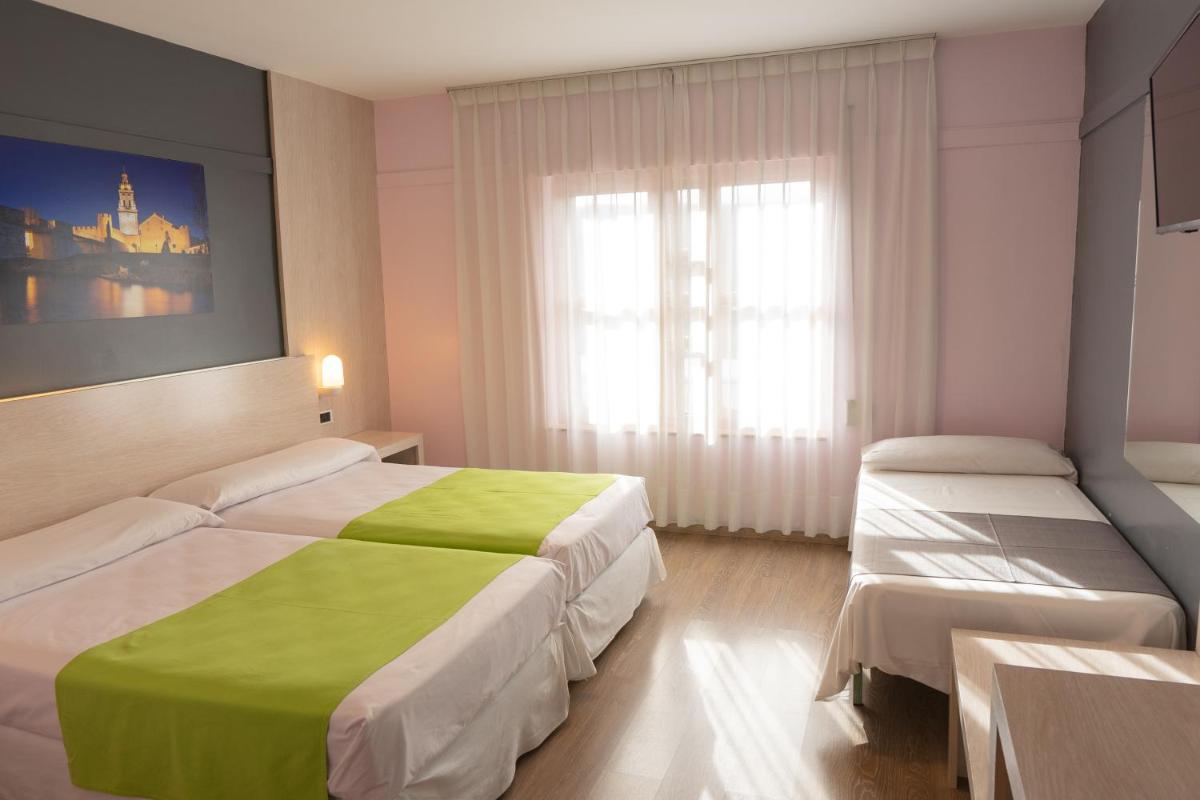Cama o camas de una habitación en Hotel Spa Rio Ucero