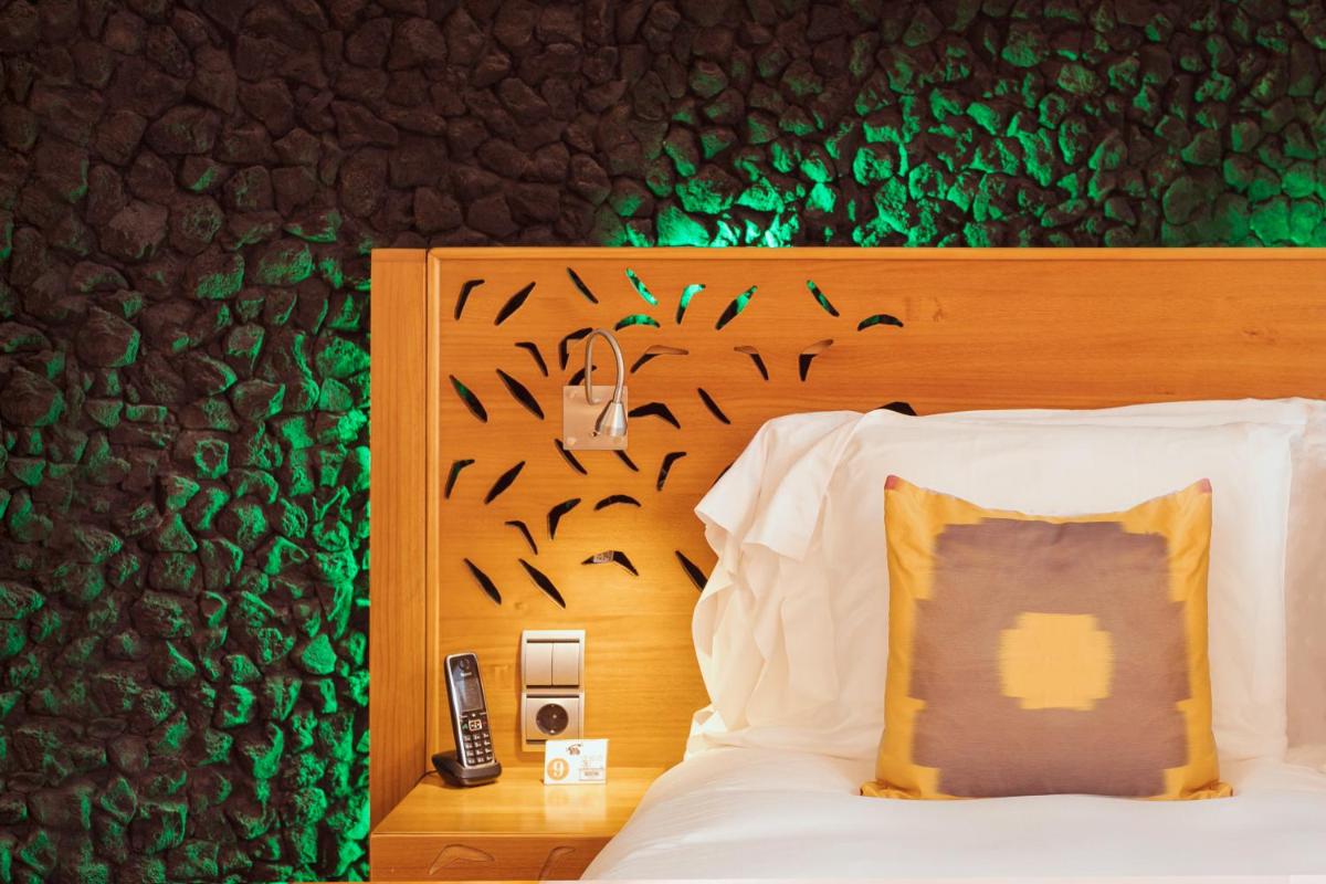 Cama o camas de una habitación en Bohemia Suites & Spa - Adults Only