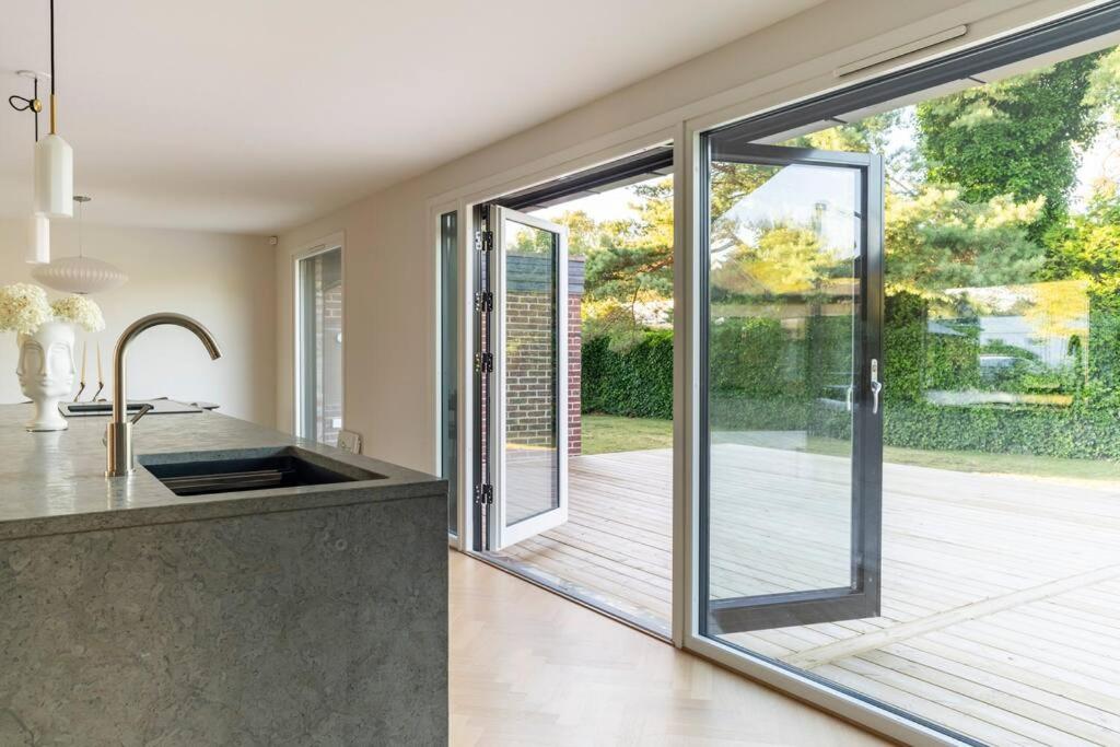 Villa Falsterbo - Beachside Luxury with Private Hot Tub - Housity