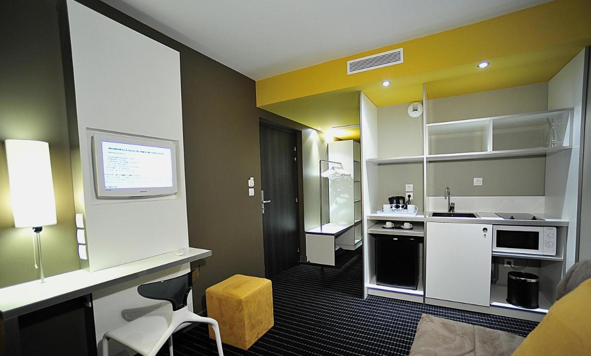 Cuisine ou kitchenette dans l'établissement B&B HOME Lyon Centre Berthelot