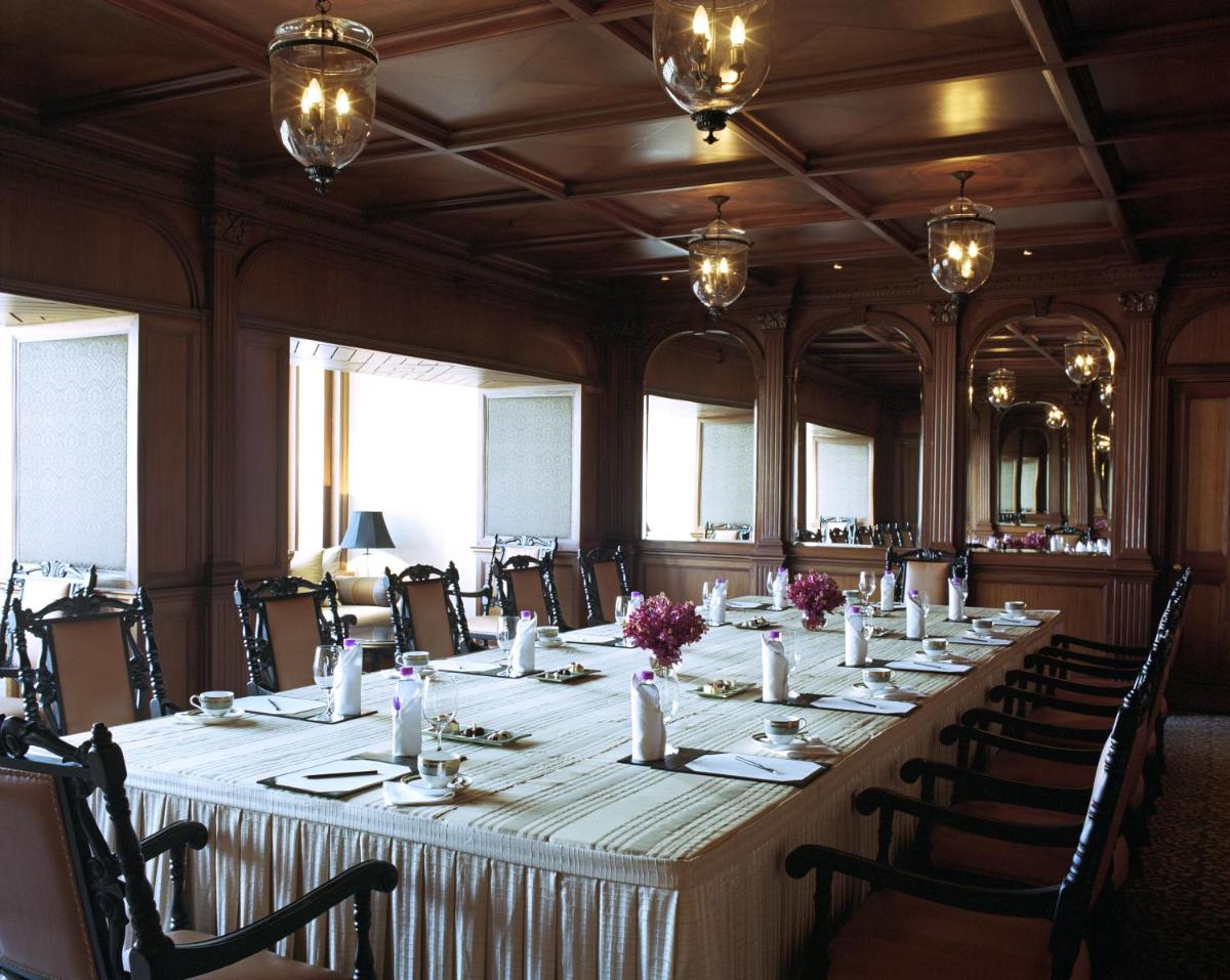 a large conference room with a long table with chairs at Taj Bengal in Kolkata