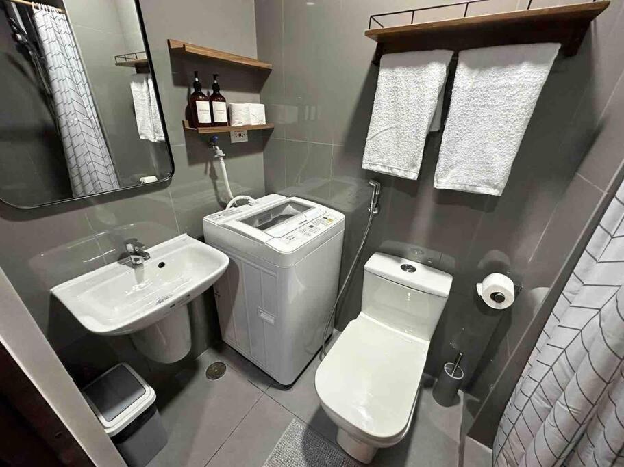 Modern Classic 1 BR Condo Air Residences Makati - Housity