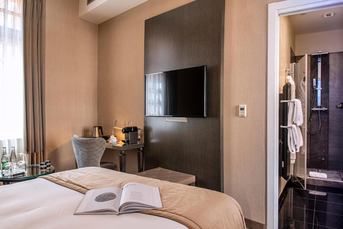 Un ou plusieurs lits dans un hébergement de l'établissement La Cour des Consuls Hotel & Spa Toulouse - MGallery Collection