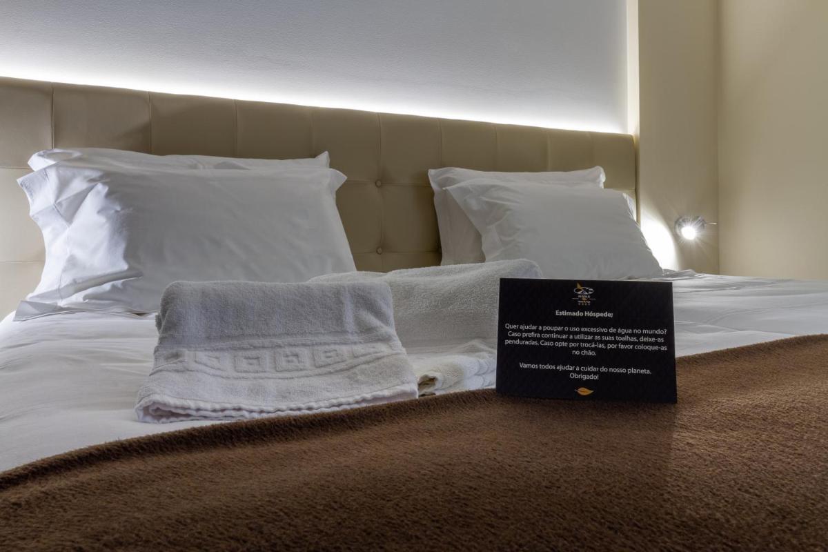 Uma cama ou camas num quarto em In Gold Hotel & Spa