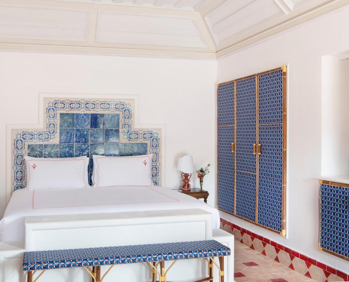 Uma cama ou camas num quarto em Vermelho Melides - Relais & Châteaux