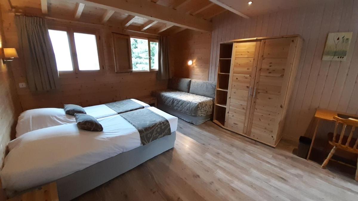 Un ou plusieurs lits dans un hébergement de l'établissement Logis Hotel & Spa Beau-Site