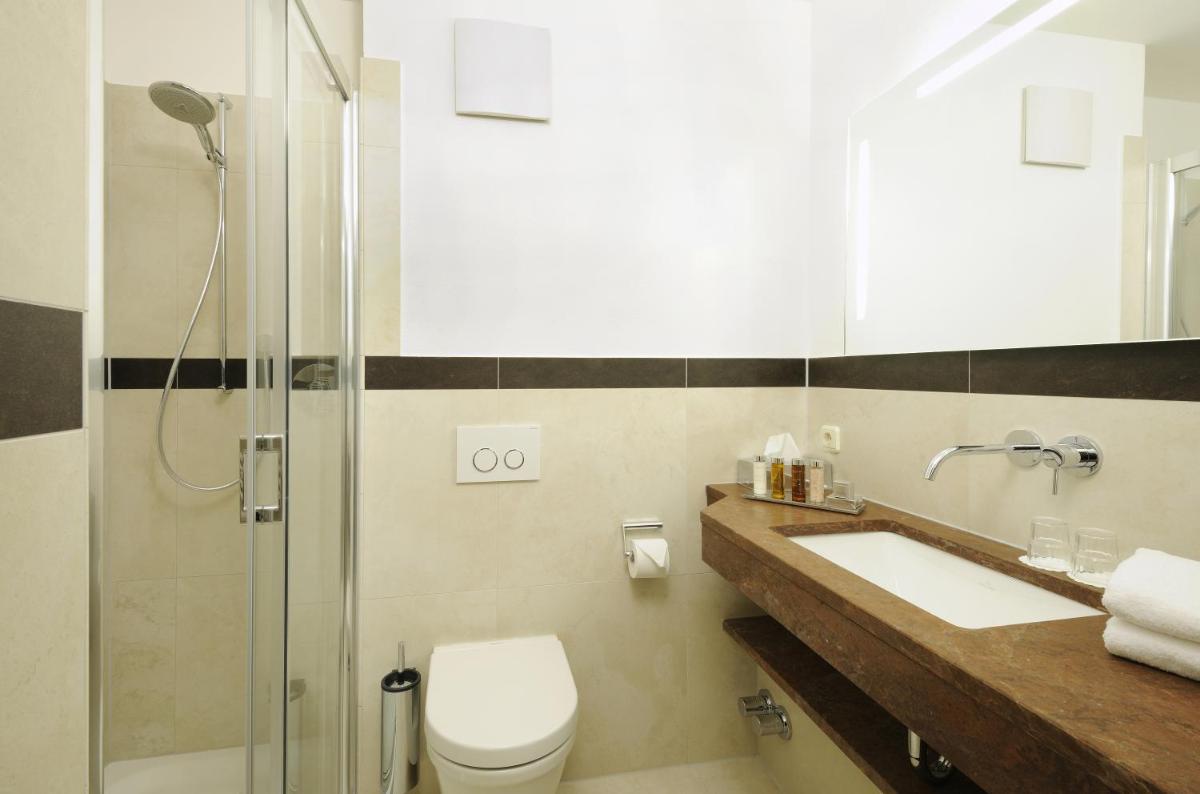 Ein Badezimmer in der Unterkunft Hotel Gut Ising