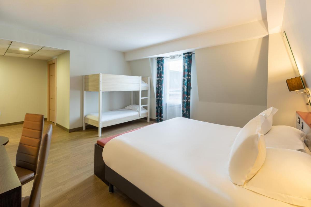 Un ou plusieurs lits dans un hébergement de l'établissement Best Western Hotel & SPA Pau Lescar Aeroport