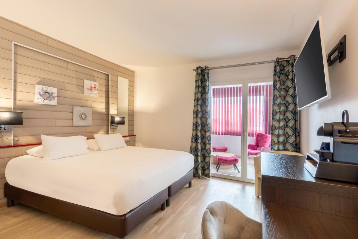 Télévision ou salle de divertissement dans l'établissement Best Western Hotel & SPA Pau Lescar Aeroport