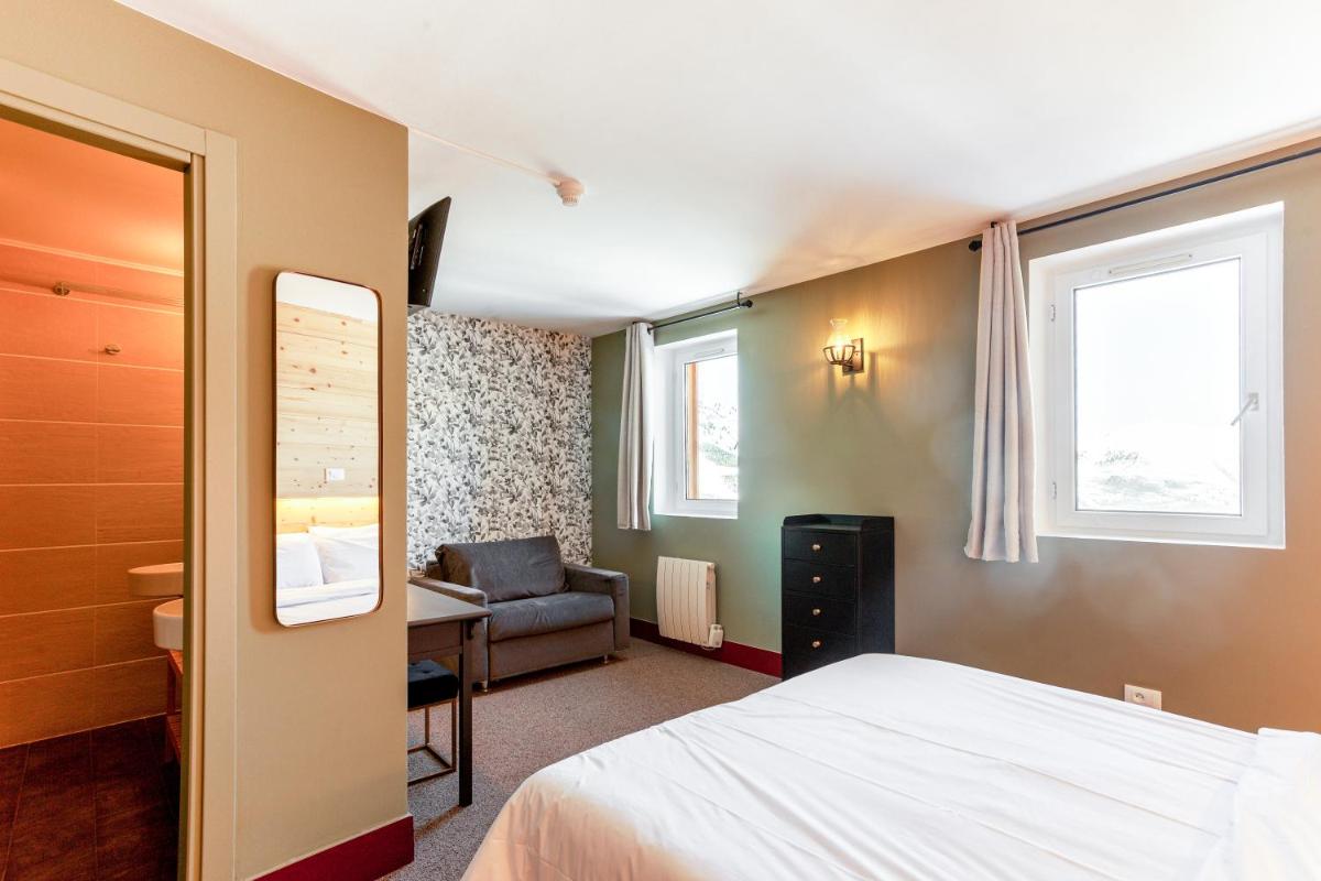 Un ou plusieurs lits dans un hébergement de l'établissement Hotel Turan & Spa