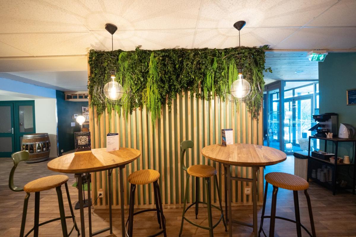 Restaurant ou autre lieu de restauration dans l'établissement Hob Fort du Pré
