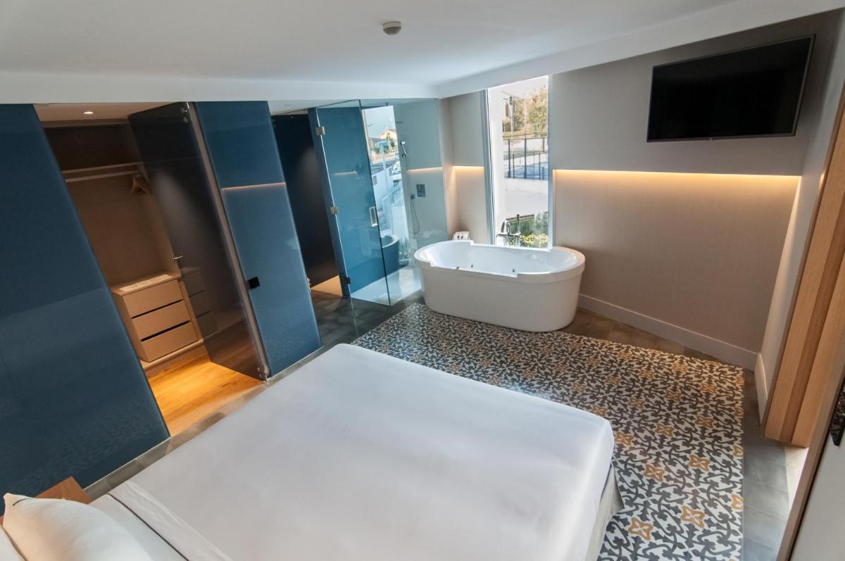 Cama o camas de una habitación en Hotel Sorli Emocions