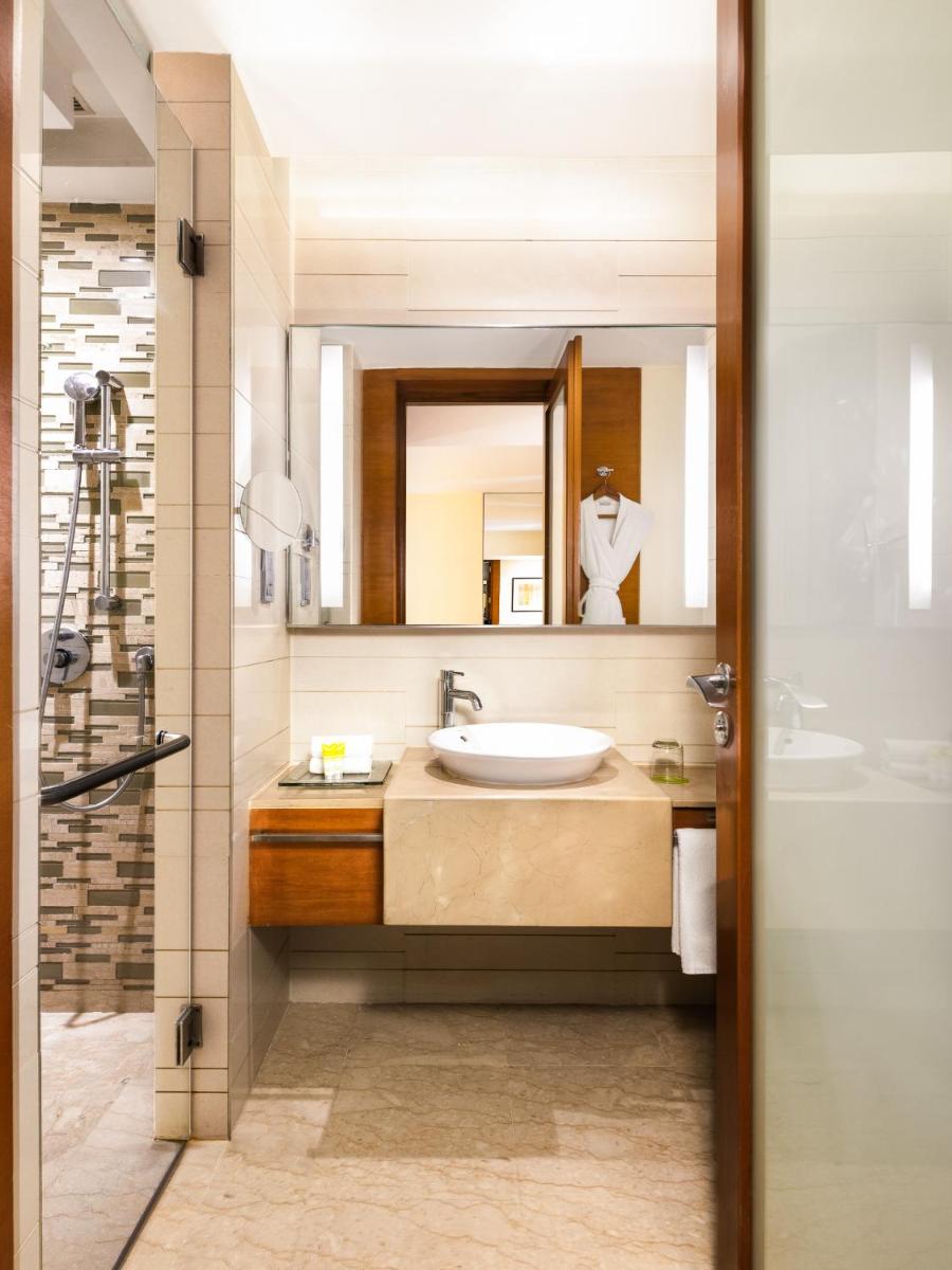 a bathroom with a sink and a mirror at Hyatt Pune in Pune
