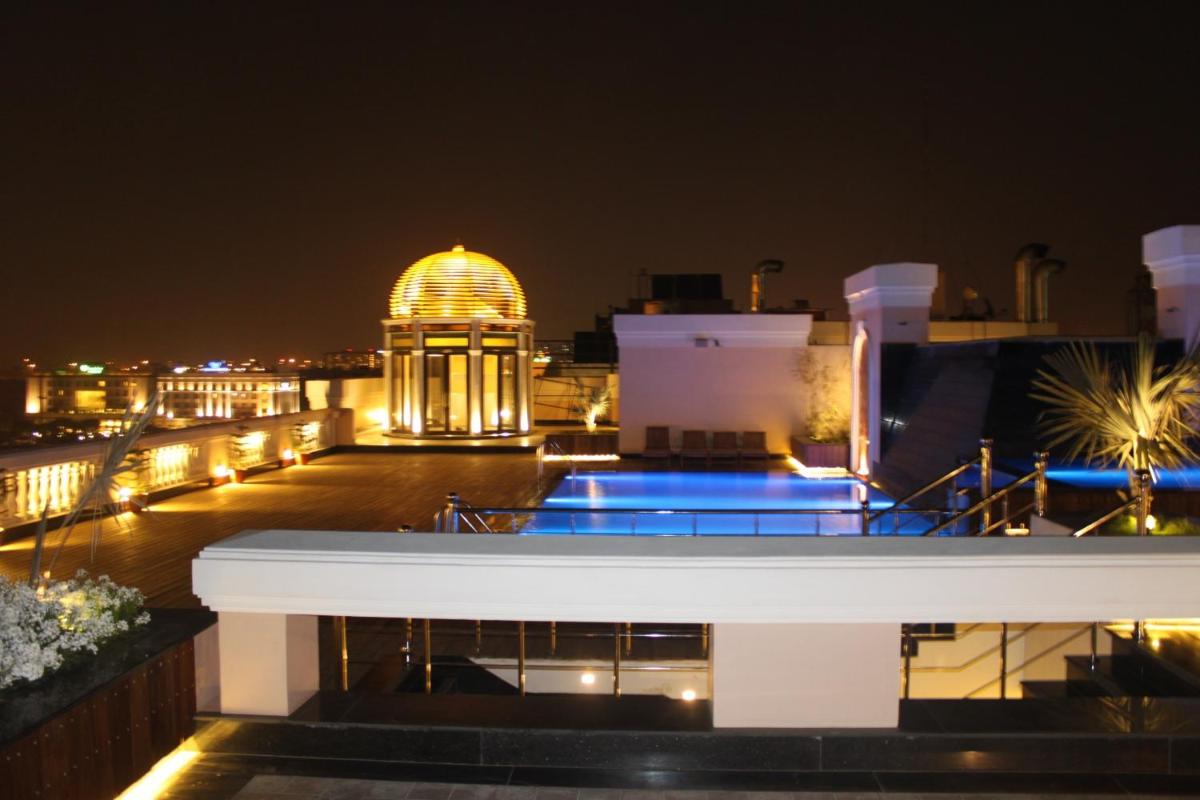 a view of a building at night at The Pllazio Hotel in Gurgaon