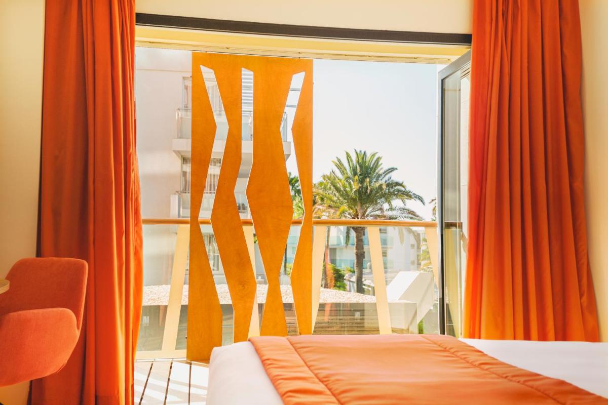 Cama o camas de una habitación en Bohemia Suites & Spa - Adults Only