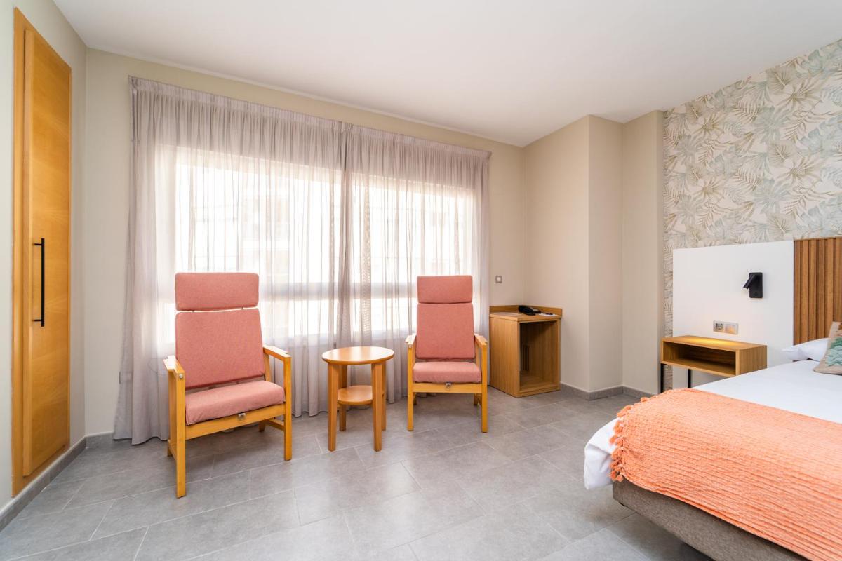Cama o camas de una habitación en Vistamar Hotel Luxury Wellness By DLV -Adults Only-