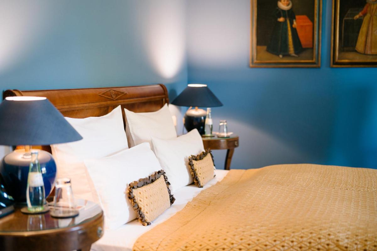 Ein Bett oder Betten in einem Zimmer der Unterkunft Schlosshotel Hugenpoet