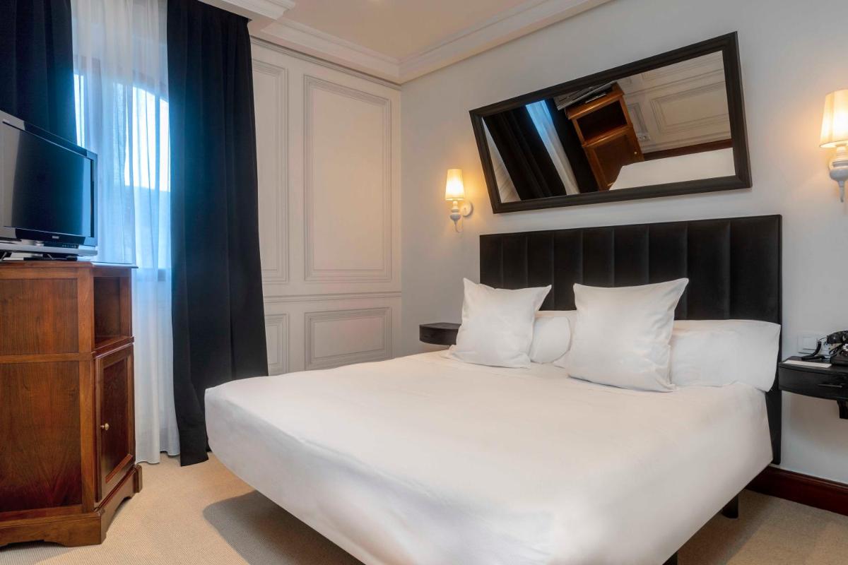 Cama o camas de una habitación en Hotel & Spa Arzuaga
