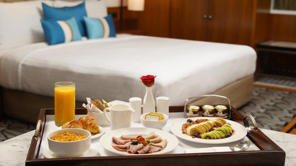 a tray of food on a table in a hotel room at InterContinental Marine Drive Mumbai by IHG in Mumbai