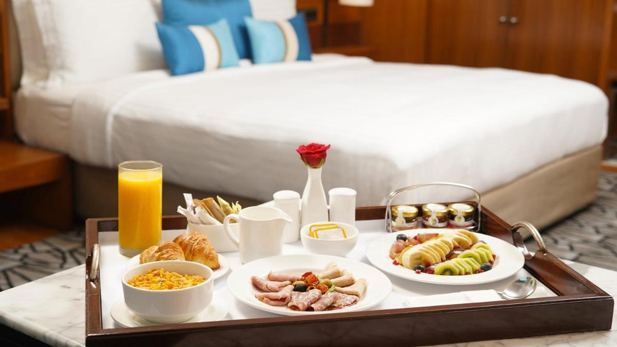 a tray of food on a table in a hotel room at InterContinental Marine Drive Mumbai by IHG in Mumbai