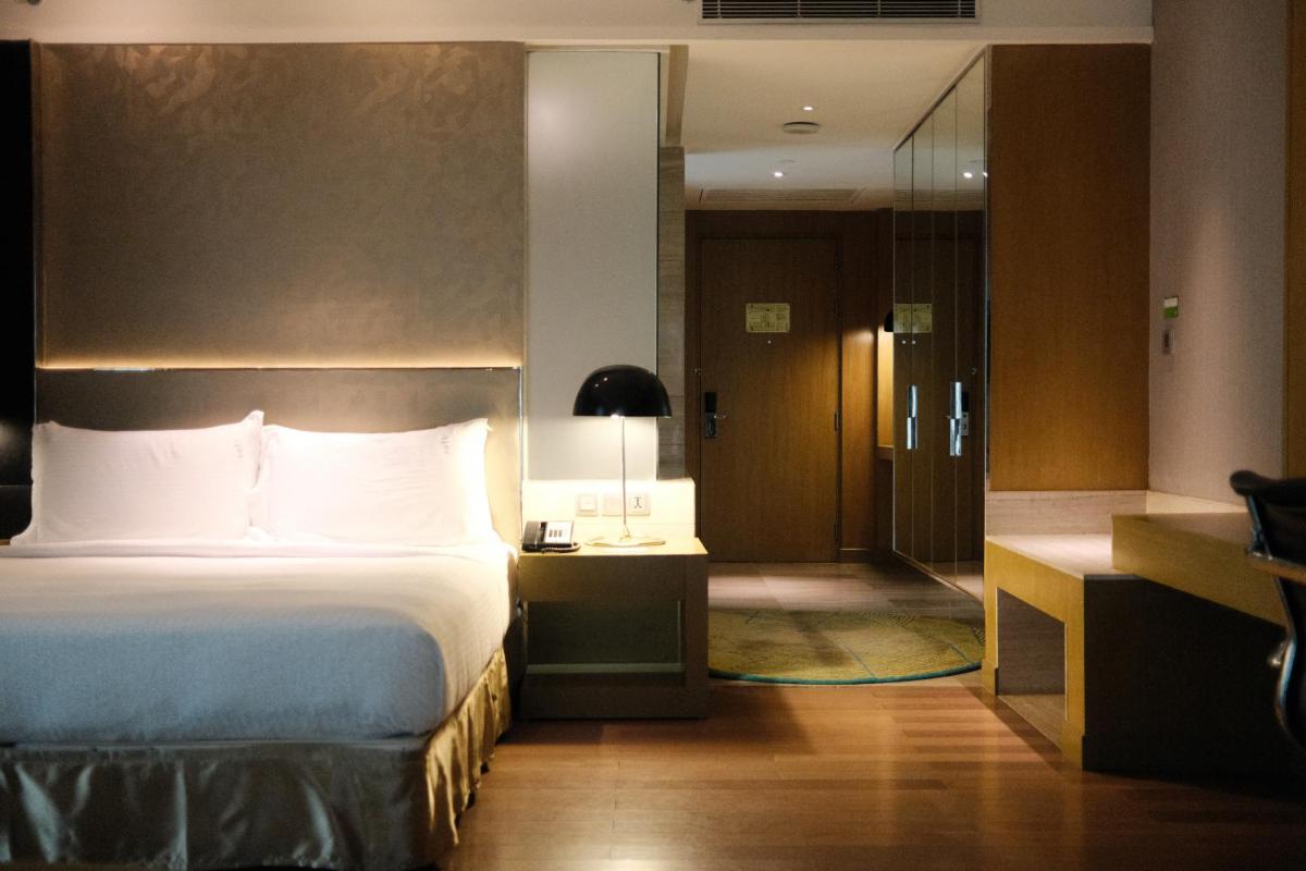 a hotel room with a bed and a bathroom at Holiday Inn New Delhi Aerocity by IHG in New Delhi